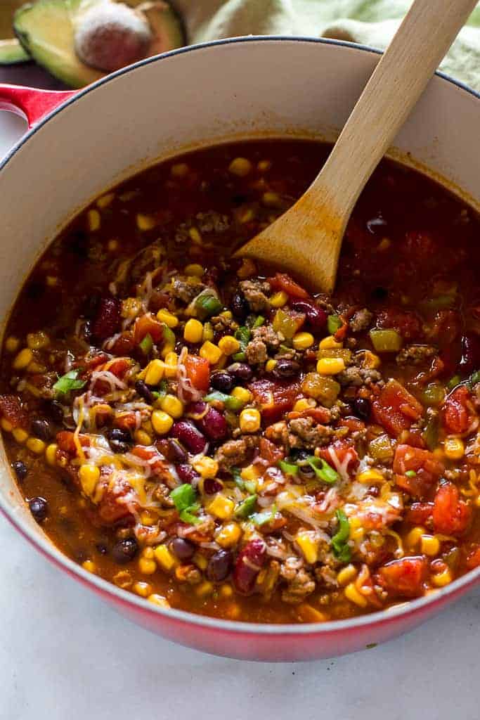 A cast iron pan full of taco soup.