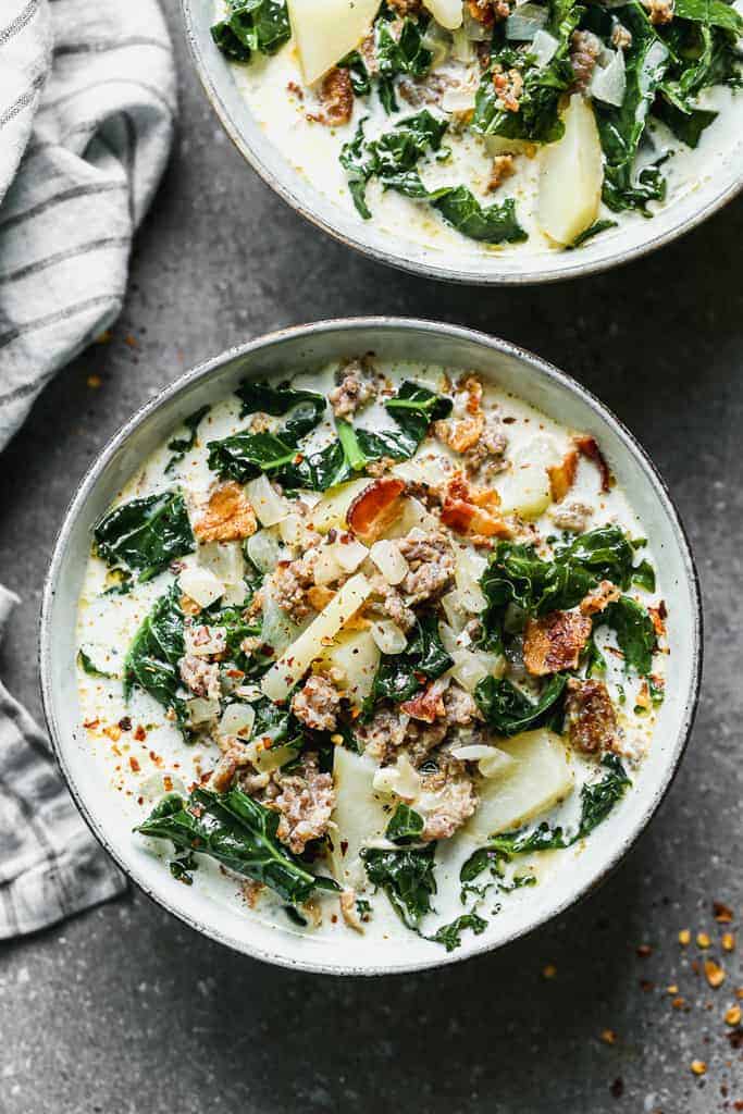 A bowl of Zuppa Toscana soup made with potatoes, bacon, sausage and kale.