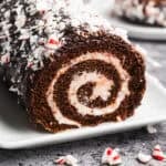 This Chocolate Cake Roll has a moist chocolate sponge cake with peppermint cream cheese frosting and chocolate ganache. It is effortless with my simple rolling trick and perfect for the holidays!