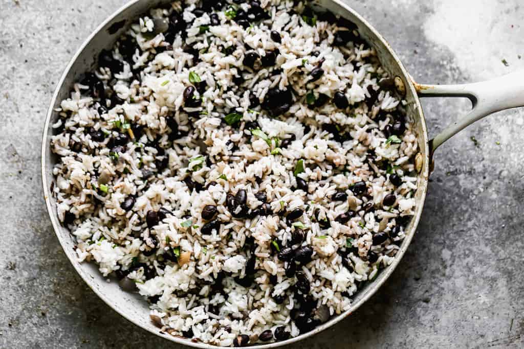 Cilantro Lime Rice and Black Beans cooked in a skillet. 