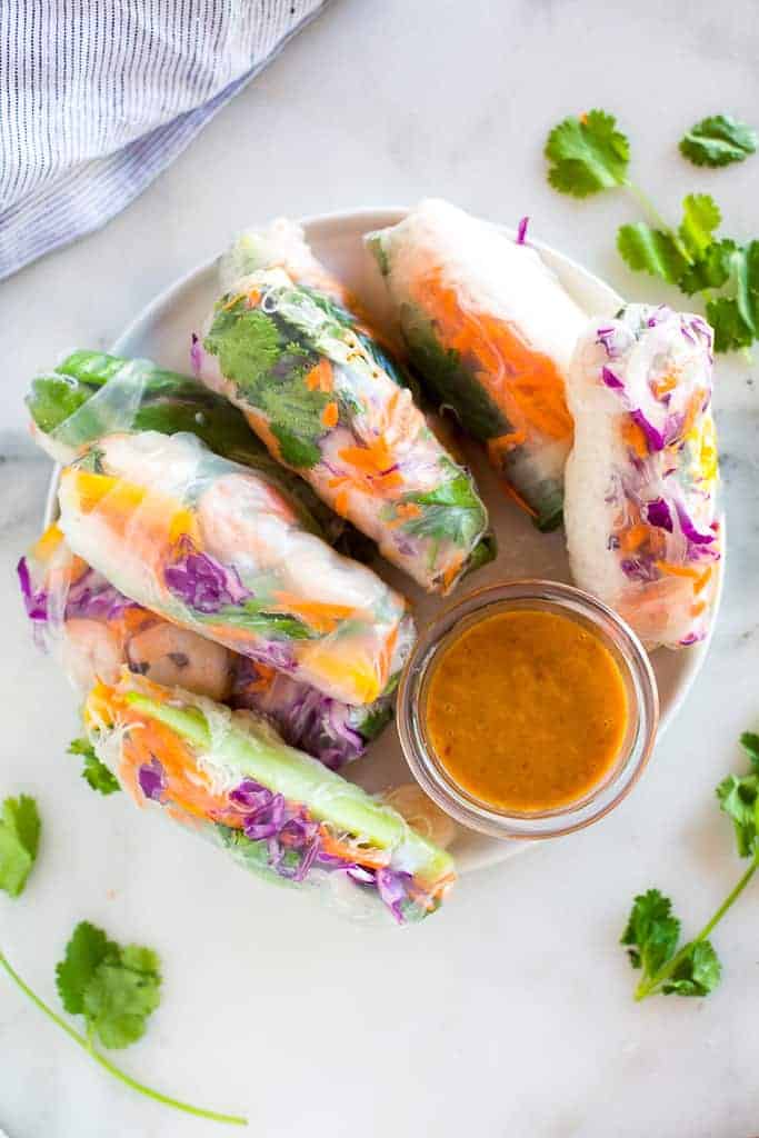 Fresh spring roll stacked on a plate.