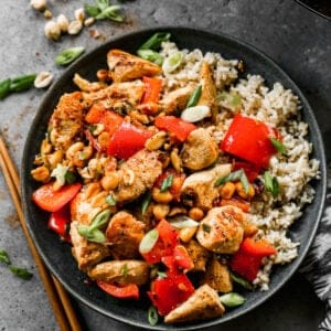 Kung Pao Chicken served on a plate with white rice.