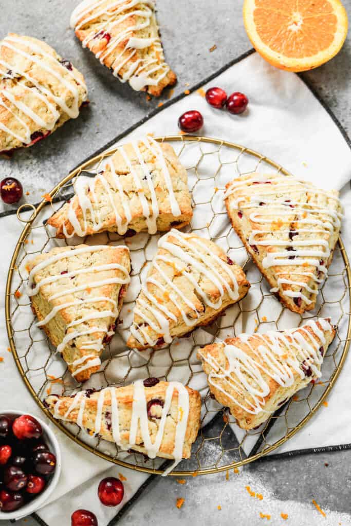 Baked cranberry orange scones on a tray.