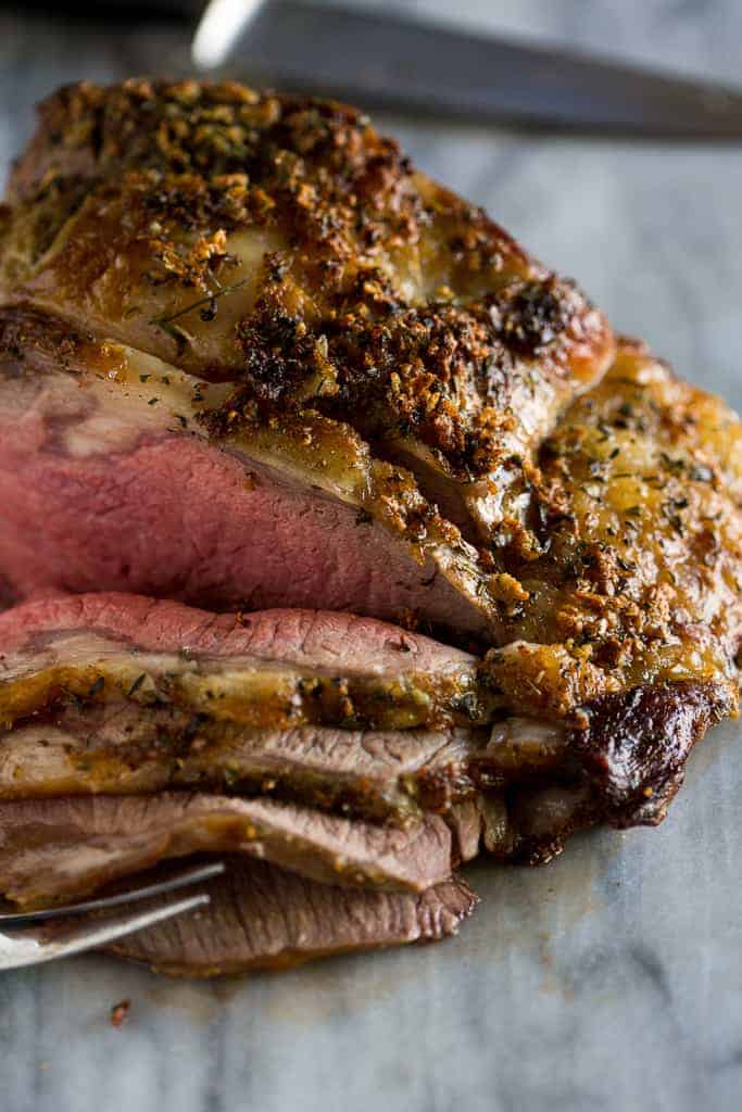 Prime rib roast carved into ½ inch thick slices.