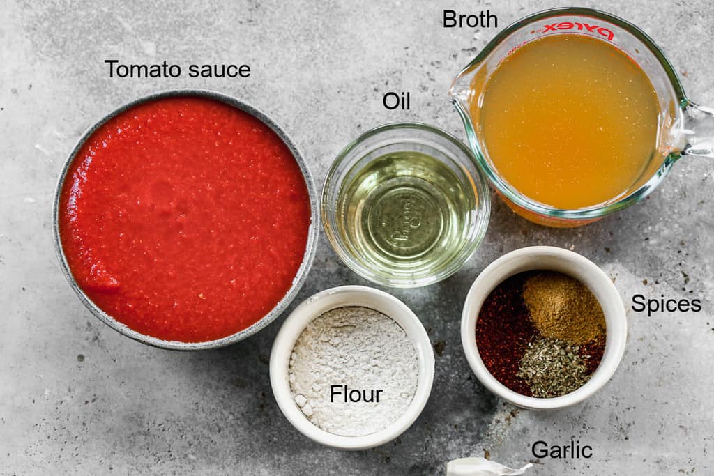 The ingredients needed to make enchilada sauce.
