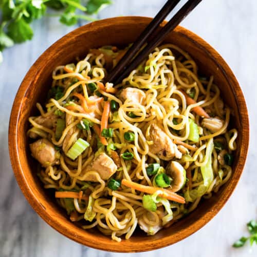 A wooden bowl filled with homemade Chicken Chow Mein recipe, ready to enjoy.