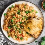 This easy Instant Pot Chicken and Rice recipe is truly so easy with dumping everything in one pot. It has bold spices, veggies, rice, and chicken for a complete meal.