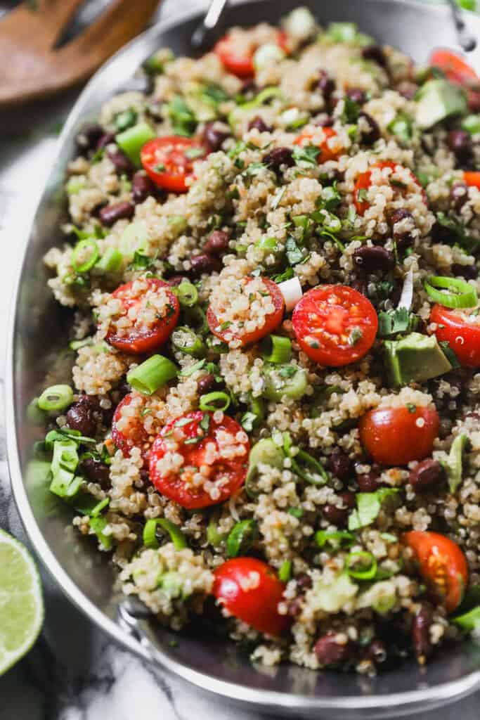 The best Quinoa Salad recipe with fresh tomatoes, herbs, and a light dressing.