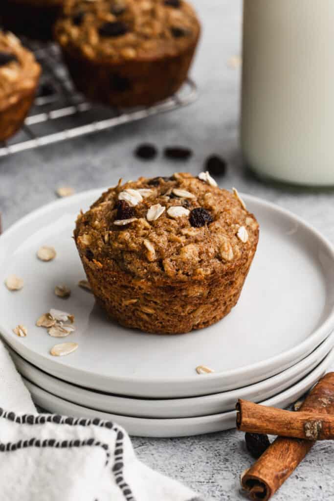 An easy Applesauce Muffin on a plate, ready to enjoy.
