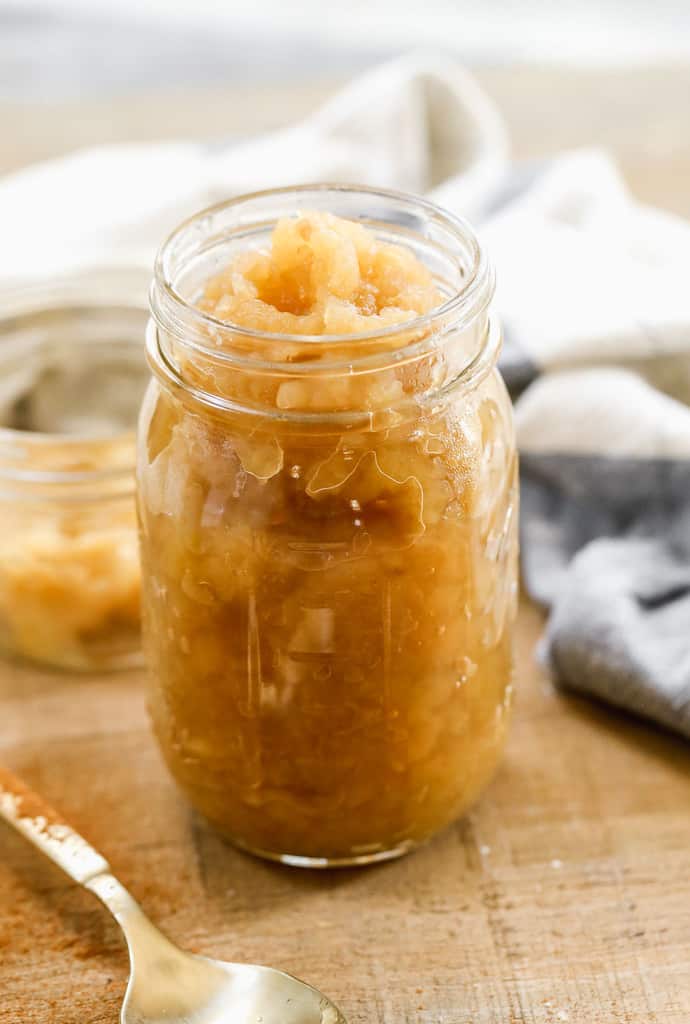 Applesauce in a quart jar, ready to be canned.