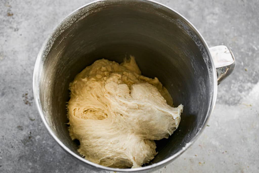 Bread dough for garlic knots mixed in a stand mixer.