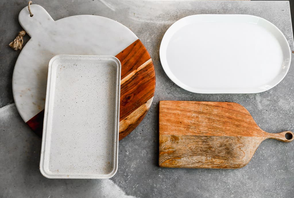 Different platters or boards to use for a charcuterie.