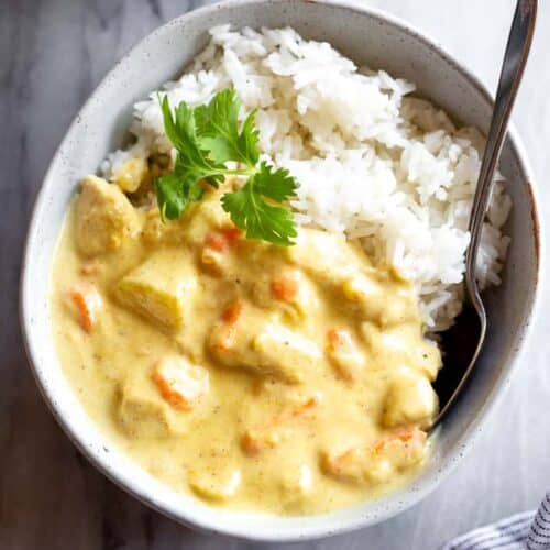 Thai yellow curry in a bowl with white rice.