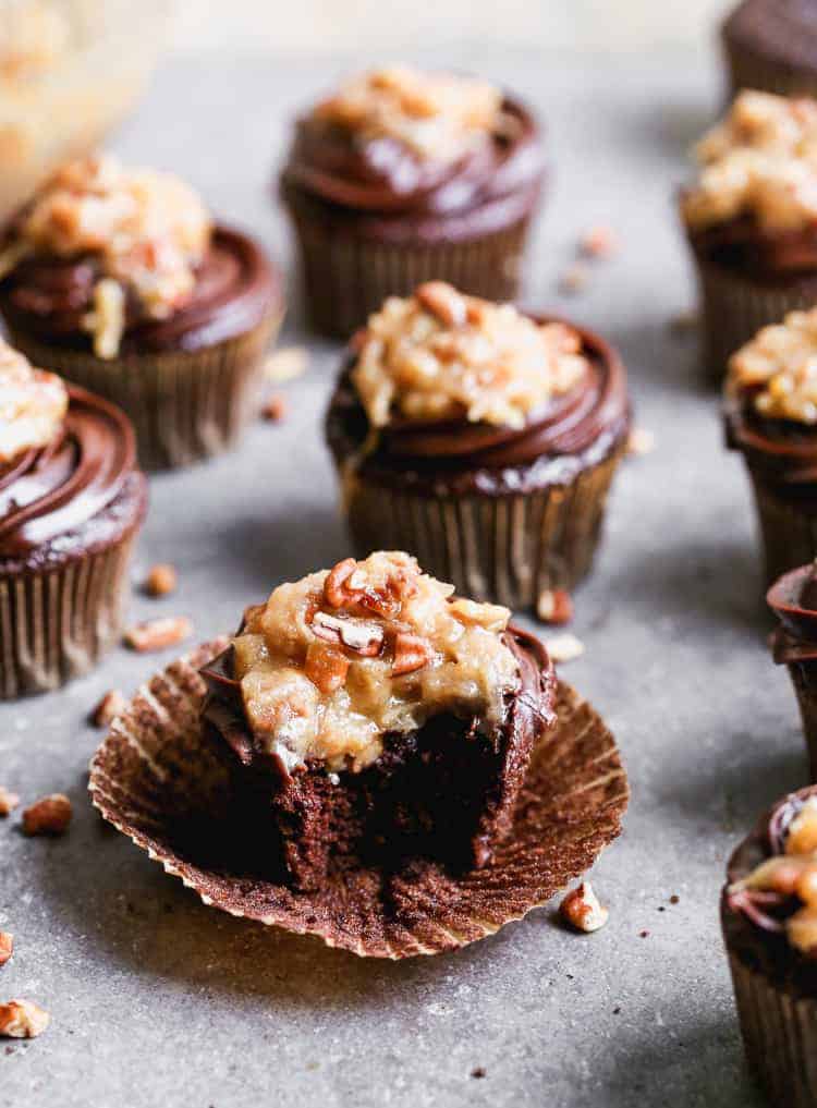 German Chocolate Cupcakes with a bite taken out of one.