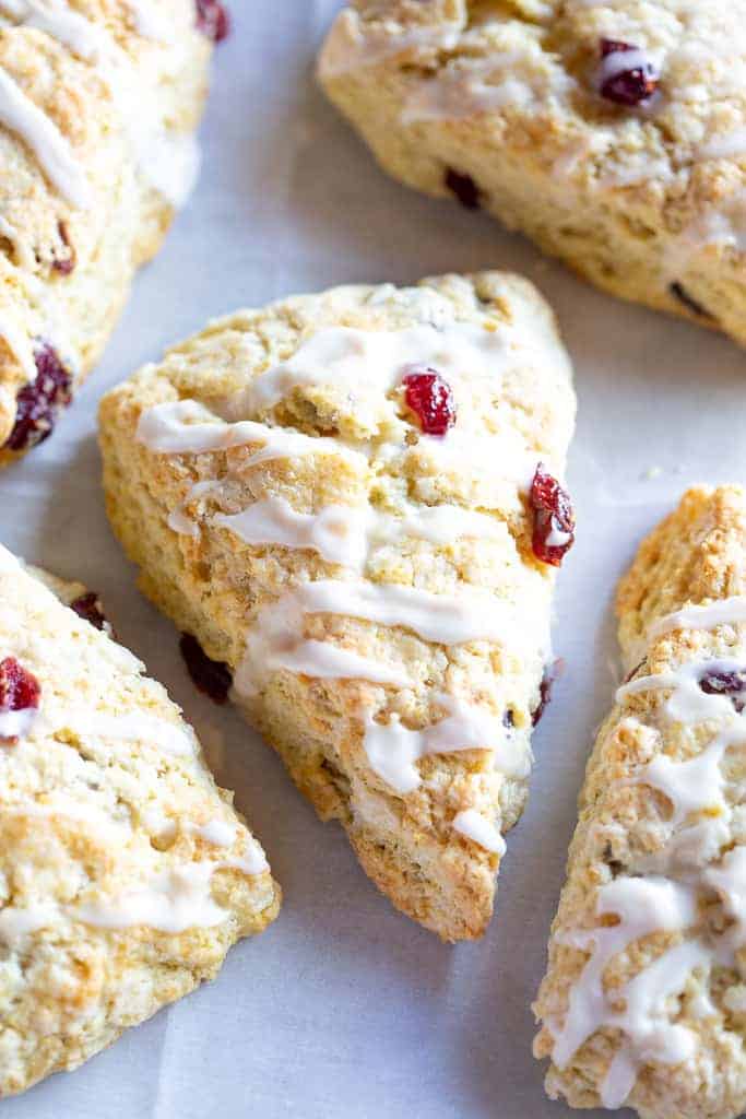 Homemade scones with dried cranberries, and glaze on top.