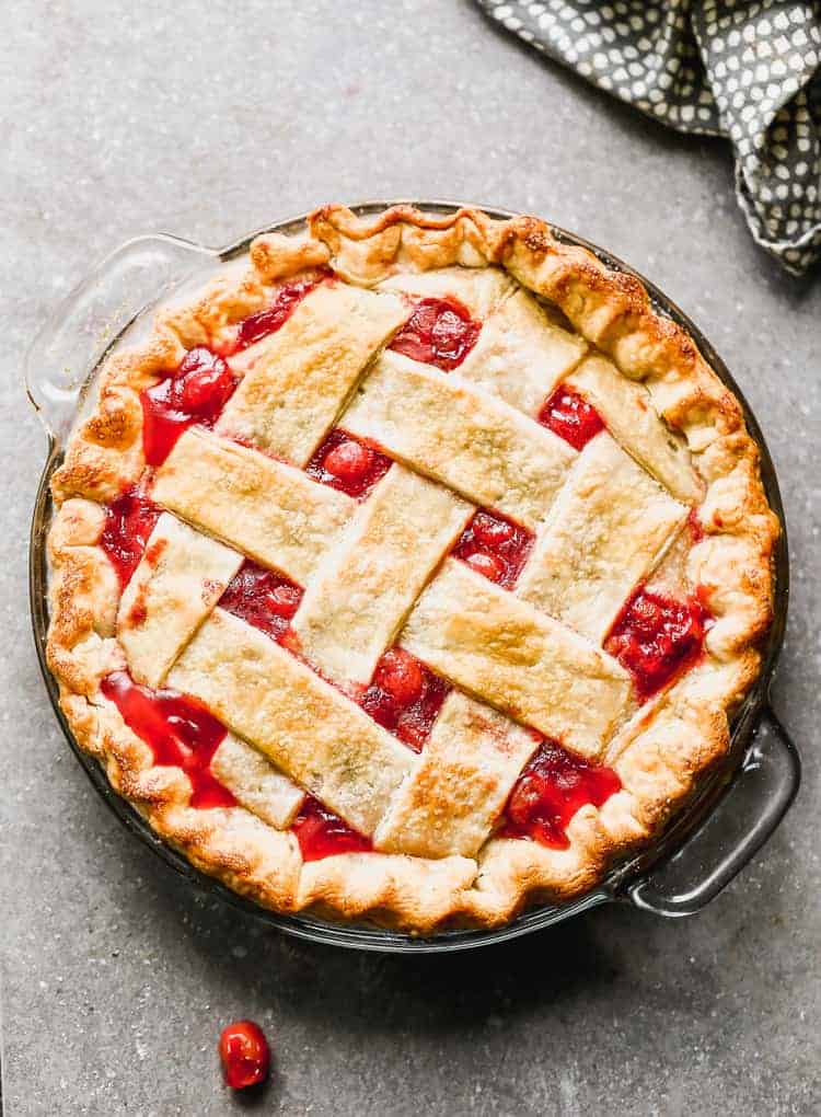 Overhead view of a baked cherry pie with lattice crust.