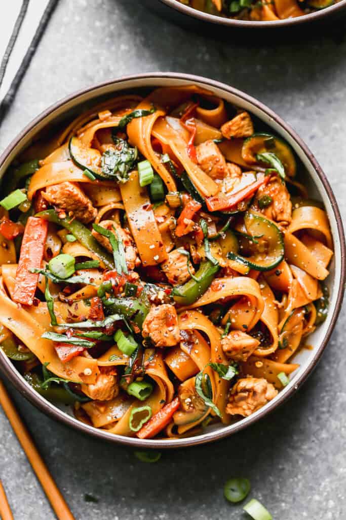 This Thai Drunken Noodles recipe is an easy noodle stir fry with a spicy kick. Control the spice level and serve it to your whole family!