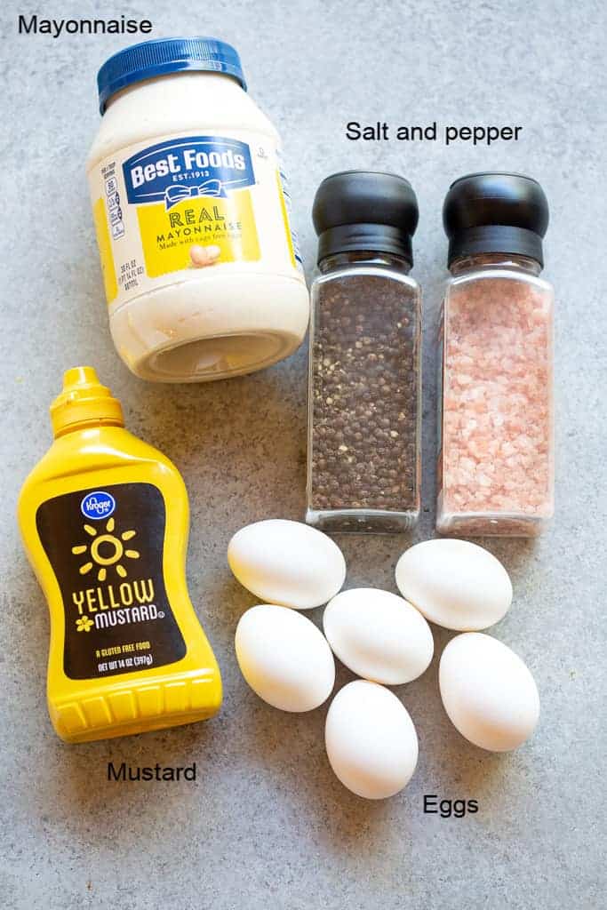 The five ingredients needed to make egg salad: eggs, mustard, mayonnaise, salt and pepper.