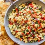 A bowl of homemade Mango Salsa with all of the ingredients diced and mixed in a large bowl.