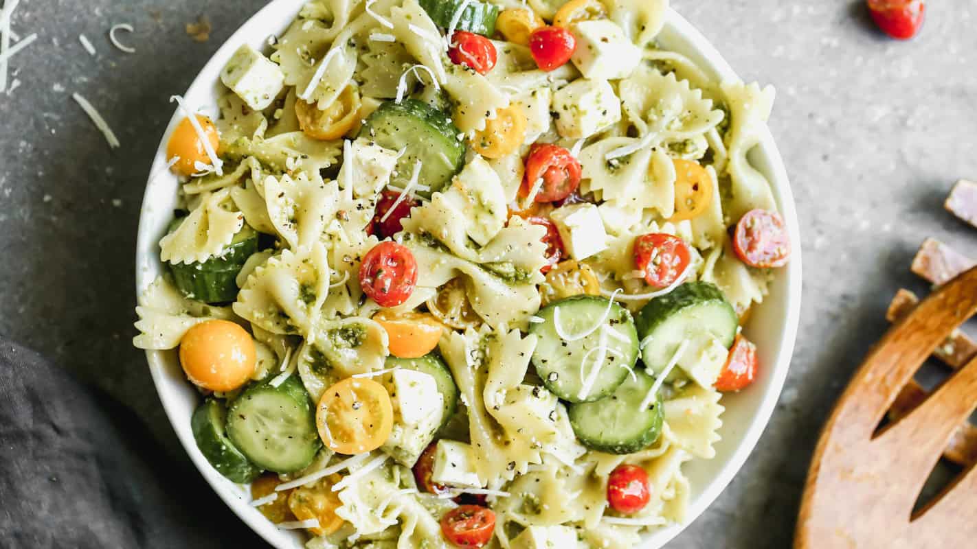 This creamy Pesto Pasta Salad recipe is so easy and combines just a few fresh ingredients for a pasta salad that everyone will gobble up!