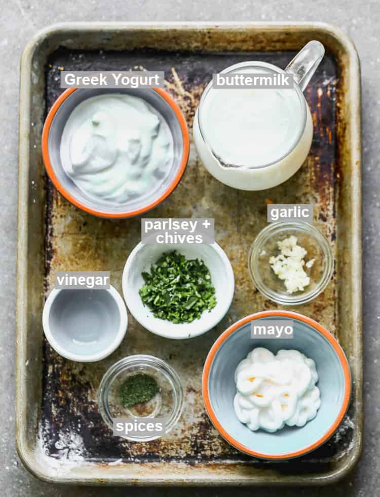 A tray with the individual, labeled, ingredients for homemade ranch dressing.