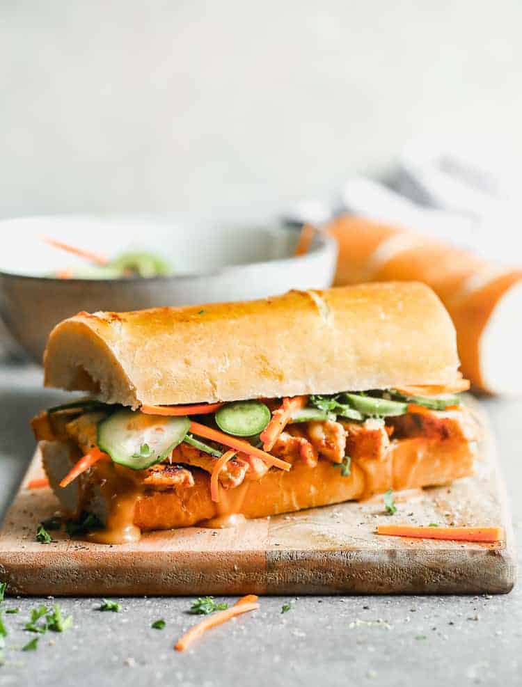 Banh mi sandwich on crusty bread, loaded with chicken, veggies and sauce.