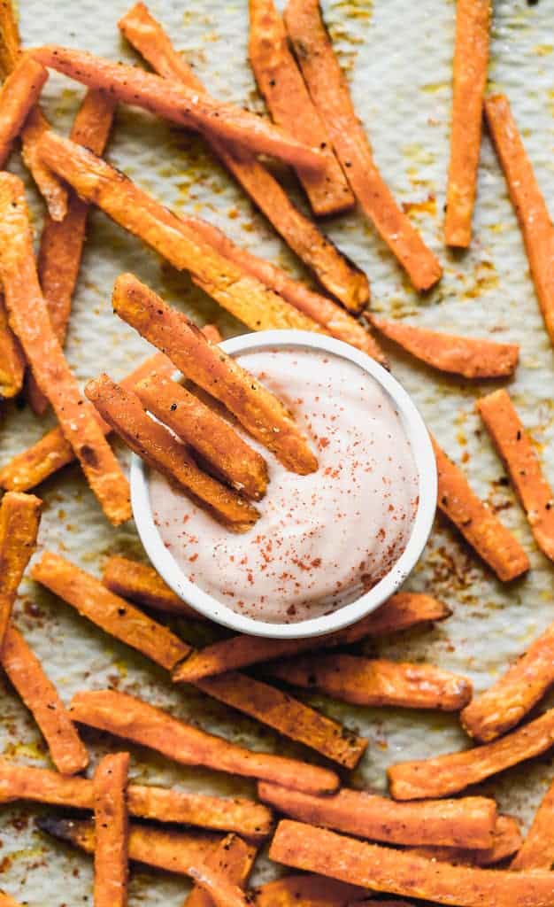 Sweet potato fries dunked in fry sauce.