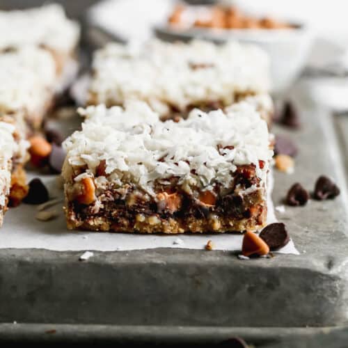 The best Magic Bars recipe cut into bars and placed on a baking sheet.