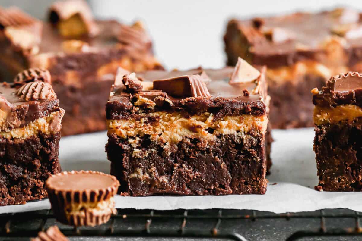 Chocolate Peanut Butter Brownies are the most irresistible dessert with the classic of chocolate and peanut butter done so well! The brownies are fudgy, the peanut butter frosting is creamy, and there are mini reese's cups in every bite!