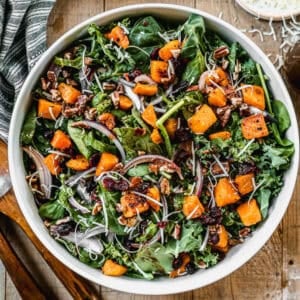 This Roasted Butternut Squash Salad is the perfect blend of warm, caramelized squash, crisp greens, and a tangy homemade dressing. It’s a flavorful and healthy fall salad recipe that makes a stunning side dish or light main course.