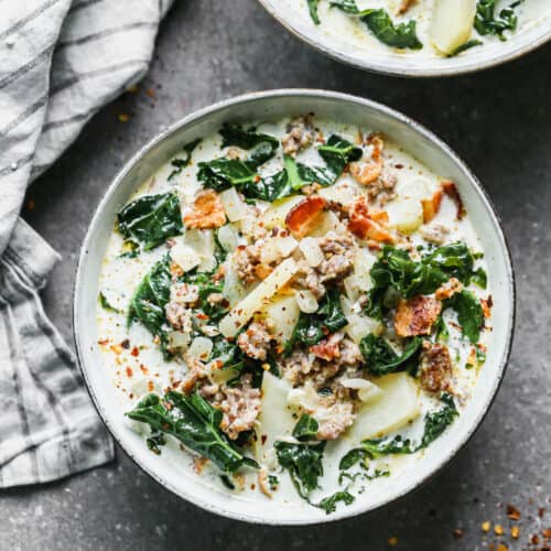 A cropped square image of a bowl of Zuppa Toscana soup, ready to enjoy.