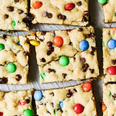 These easy M&M Cookie Bars only take 30 minutes to make and are easy to cut and feed a crowd! They are everyone's favorite cookie, now easier!