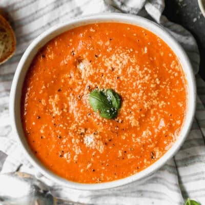 This Roasted Tomato Soup recipe is bursting with flavor and is the perfect soup next to a grilled cheese. It's a copycat of my favorite Panera soup!
