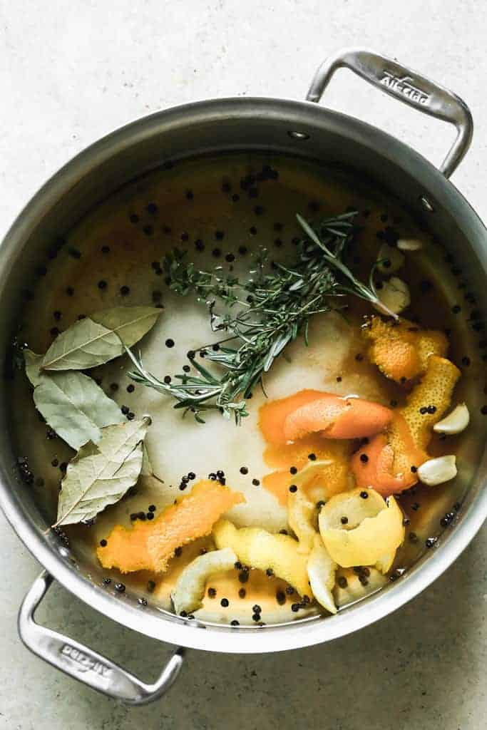 A large stock pot filled with turkey brine.