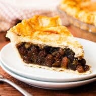 This easy Raisin Pie recipe is flavorful, sweet, and delicious in a flaky golden pie crust.
