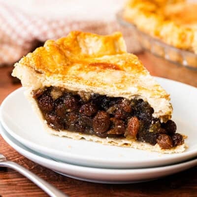 This easy Raisin Pie recipe is flavorful, sweet, and delicious in a flaky golden pie crust.