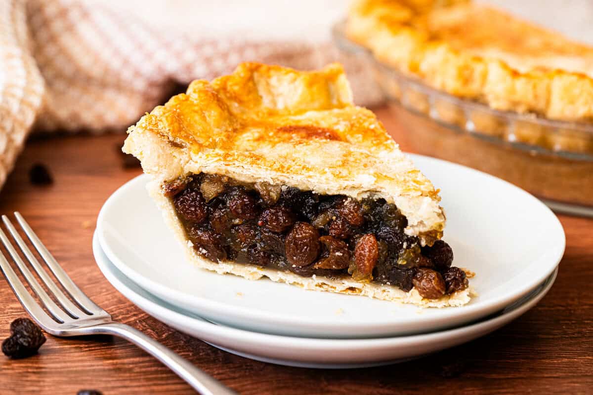 This easy Raisin Pie recipe is flavorful, sweet, and delicious in a flaky golden pie crust. 