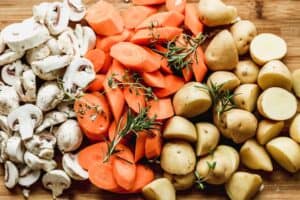 Chopped mushrooms, carrots and potatoes.