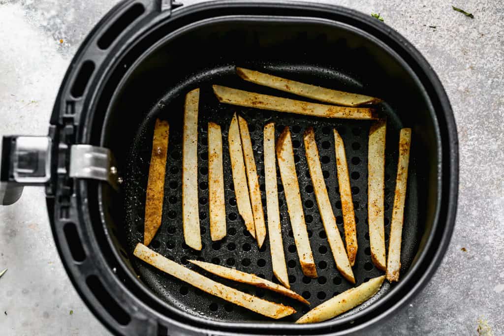 French fries in the basket of an Air Fryer.