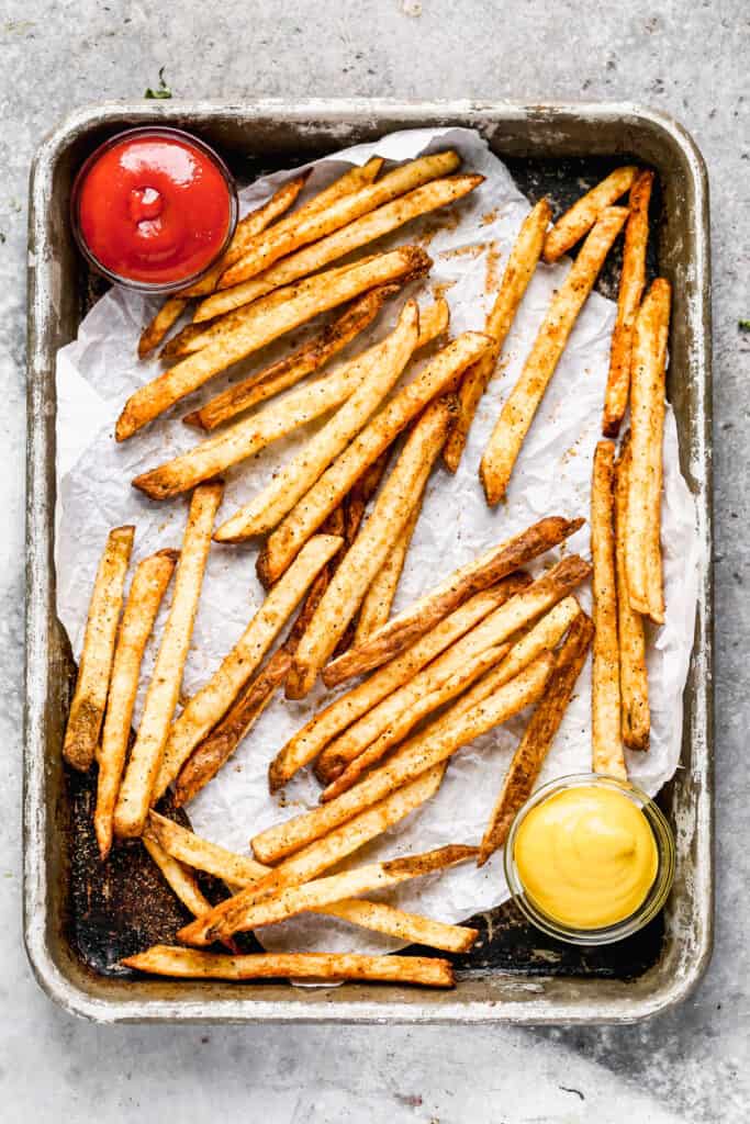 A baking tray with crispy Air Fryer French Fries.