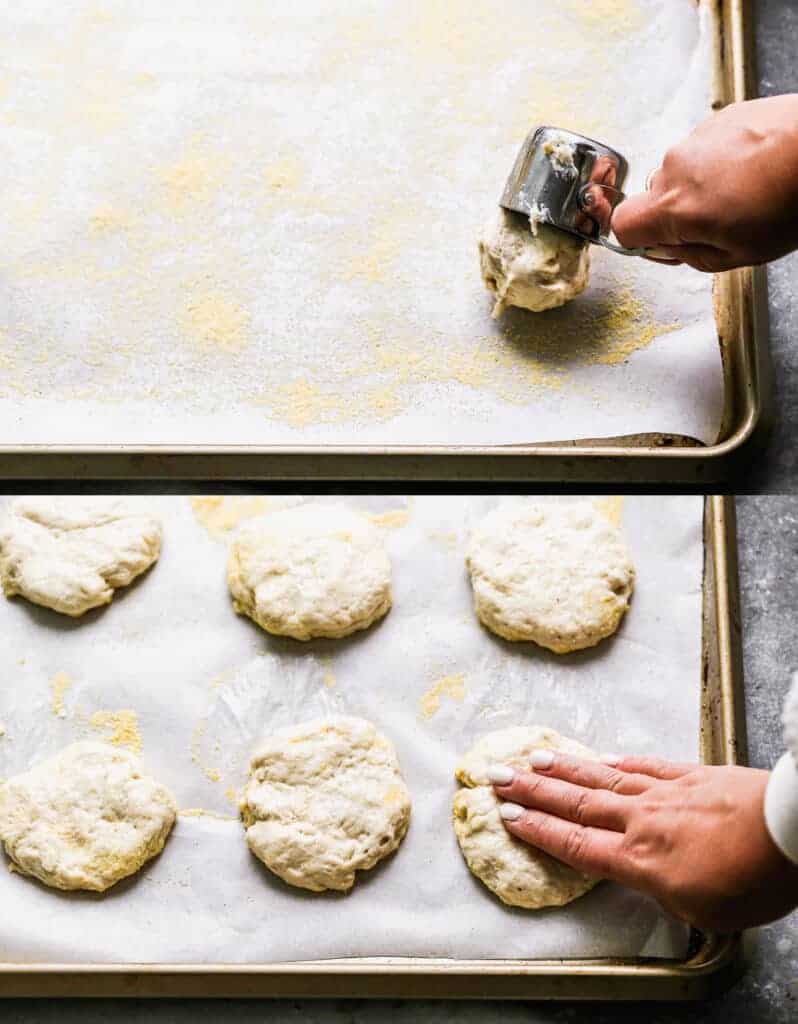 A measuring cup scooping English Muffin batter onto a lined sheet pan, then a hand shaping it into a disc.