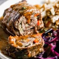 This beef Rouladen recipe is a German staple with mustard, bacon, and veggies wrapped in meat then slow braised until it melts in your mouth. It's perfect for Sunday dinner or any holiday!