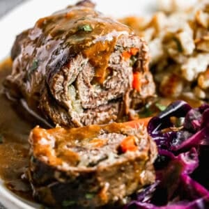 This beef Rouladen recipe is a German staple with mustard, bacon, and veggies wrapped in meat then slow braised until it melts in your mouth. It's perfect for Sunday dinner or any holiday!