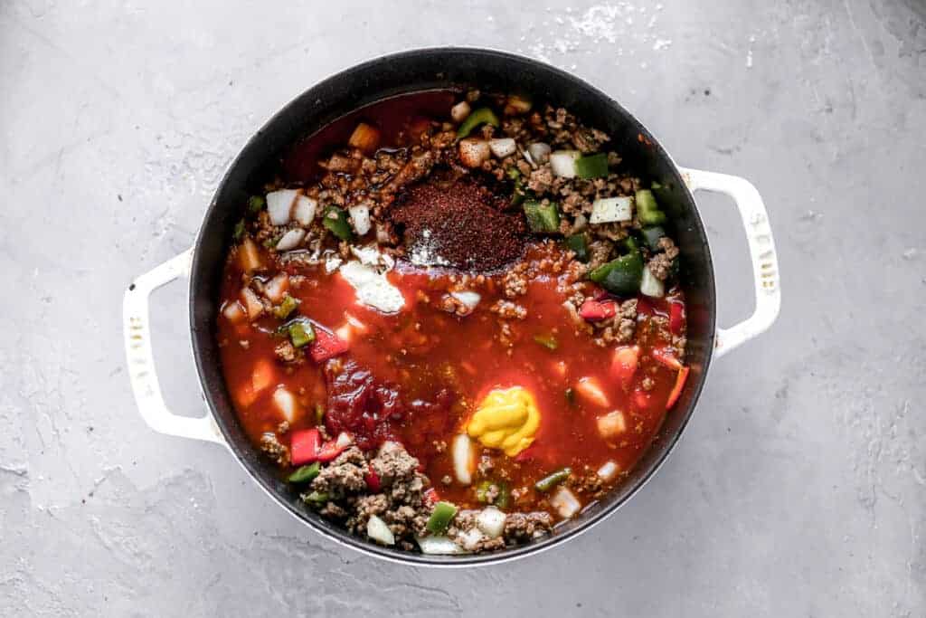 The ingredients for Spicy Chili in a large pot, ready to mix together.