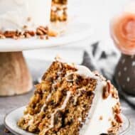 A slice of carrot cake on a plate.