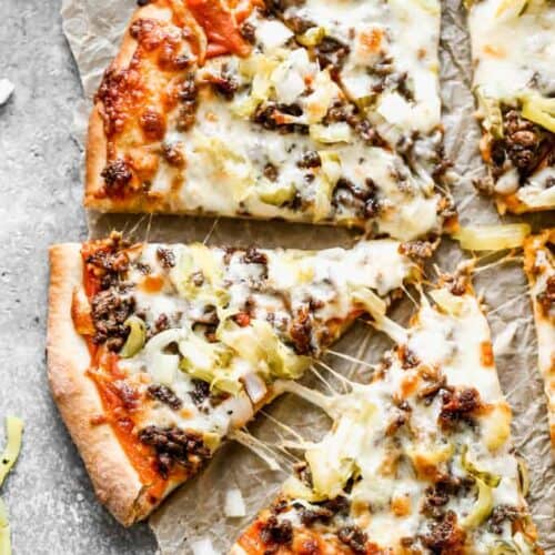 Cheeseburger Pizza baked and cut into slices.