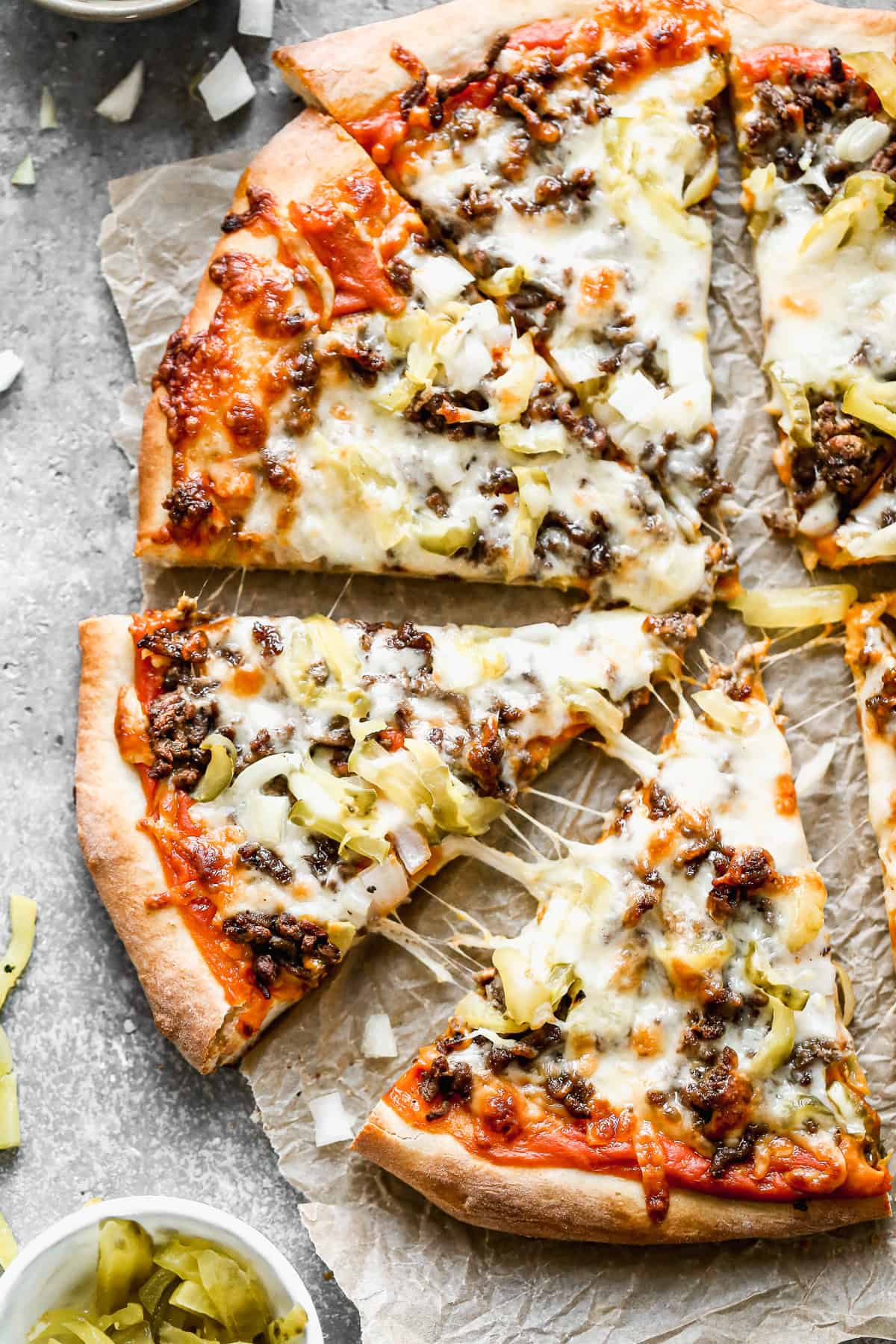The best Cheeseburger Pizza recipe cut into slices and ready to serve!
