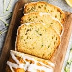 A loaf of easy and moist Lemon Zucchini Bread drizzled with a delicious glaze, this quick bread can be enjoyed for breakfast, brunch, snack, or dessert.