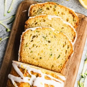 A loaf of easy and moist Lemon Zucchini Bread drizzled with a delicious glaze, this quick bread can be enjoyed for breakfast, brunch, snack, or dessert.