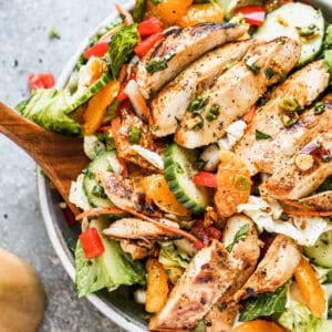 The best Asian Chicken Salad recipe has mandarin oranges, cucumbers, lettuce, carrot, bell peppers, and juicy chicken. We use an easy dressing as the marinade and dressing.